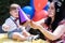 charming one-year-old baby floating soap bubbles, vibrant balloon decorations, birthday celebration.