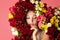 Charming portrait of pensive woman with rose flowers