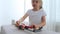 Charming preschooler playing with small constructor. Little girl playing with connecting toy cubes.