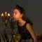 Charming Preteen Girl Blowing out Candles in Vintage Chandelie.