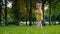 Charming pretty little girl dancing and rejoicing while walking in the park