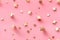 Charming scattered golden stars on a soft pink background, a whimsical pattern perfect for celebratory themes or chic