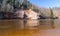 Charming spring landscape with sandstone cliffs on the river bank, fast flowing and clear river water