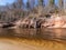 Charming spring landscape with sandstone cliffs on the river bank, fast flowing and clear river water