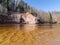 Charming spring landscape with sandstone cliffs on the river bank, fast flowing and clear river water