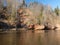 Charming spring landscape with sandstone cliffs on the river bank, fast flowing and clear river water