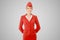 Charming Stewardess Dressed In Red Uniform On Gray Background.