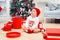 Charming toddler boy holds christmas gift box. Concept of Christmas holidays.