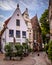 Charming urban alley with various architectural structures in Bremen, Germany.