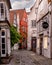 Charming urban alley with various architectural structures in Bremen, Germany.