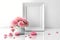 Charming Vignette: Flat Lay of Blank Frame and Pink Flowers in Vase on White Background