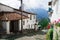 Charming village located outside Quito Ecuador with bridgestone road leading down to dome tower of spanish colonial