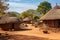 A charming village nestled amidst nature, featuring traditional thatched roofs and a rustic dirt road, Traditional tribal huts in