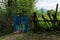 Charming Vintage Ambiance: Freshly Painted Blue Garden Gates on a Rural Estate