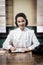 Charming vintage receptionist working at office desk