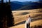 Charming wedding couple standing on the mountain peak. Honeymoon in Alps