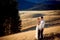 Charming wedding couple standing and smiling on the mountain peak. Honeymoon in Alps