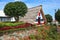 Charming white cottage with a thatched roof gable