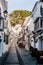 Charming whitewashed narrow street In Mijas