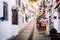 Charming whitewashed narrow street In Mijas