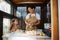 Charming woman hands-on varenyky, handmade dumplings, enjoys cooking with her cute little helper, an adorable daughter
