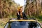 Charming Woman Leaning at Yellow Auto Sunroof