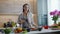 Charming Woman Listens To Music in Headphones for Pleasant Cooking.