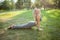 Charming young sportswoman exercising at the park in the morning