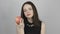 Charming young woman eats a pink apple and smiles