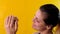 Charming young woman holding a burger in her hands. Smiling caucasian woman strokes a tasty beef burger.