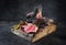 Charred Barbecue dry aged wagyu bistecca alla Fiorentina beef steak on an old rustic wooden board