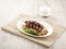 Charred BBQ Pork Noodle with chopsticks served in a dish isolated on mat side view on grey background