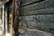 Charred black wooden wall. Angle Image of a burned boards of slum house