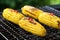 charred corn on the cob on a cooling rack