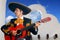 Charro Mariachi playing guitar Mexico houses