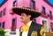 Charro mexican Mariachi portrait in pink house
