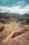 Charyn Grand Canyon with clouds and sun red orange stone Martian landscape