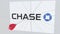 CHASE company logo being cracked by archery arrow. Corporate problems conceptual editorial 3D rendering