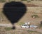 A Chase Vehicle Tries to Catch Up with a Hot Air Balloon