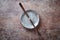 Chashaku Matcha spoon and empty ceramics plate on rustic stone background.