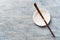 Chashaku Matcha spoon and empty ceramics plate on rustic wooden background.