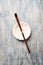Chashaku Matcha spoon and empty ceramics plate on rustic wooden background.