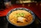 Chashu pork Ramen with fresh vegetable and dried seaweed in japanse pattern bowl