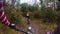 Chasing a rider in a mountain bike race in a single track forest trail
