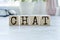 CHAT Word Written In Wooden Cube on wooden table