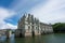 Chateau de Chenonceau with blue sky & silky river