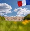 Chateau de Versailles with flag of France in Paris, FRANCE