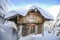 Chateau in the winter mountains, a hut in the snow. Winter mountain landscape. Karkonosze, Poland