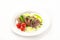 Chateaubriand in a restaurant close-up. Beef tenderloin steak with tomatoes on a white plate and copy space