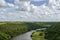 Chavon River, riverbed, tropical vegetation, the sky is covered with clouds in the background